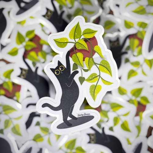 Black cat and pothos