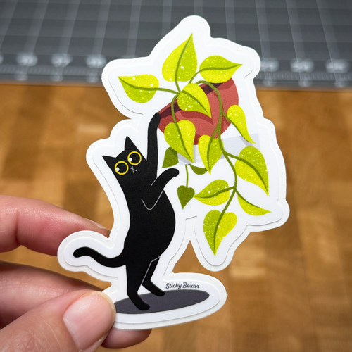 Black cat and pothos